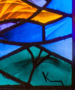 Detail of a window by Richard King, showing his signature.
