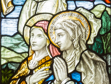 stained glass figures of two women.