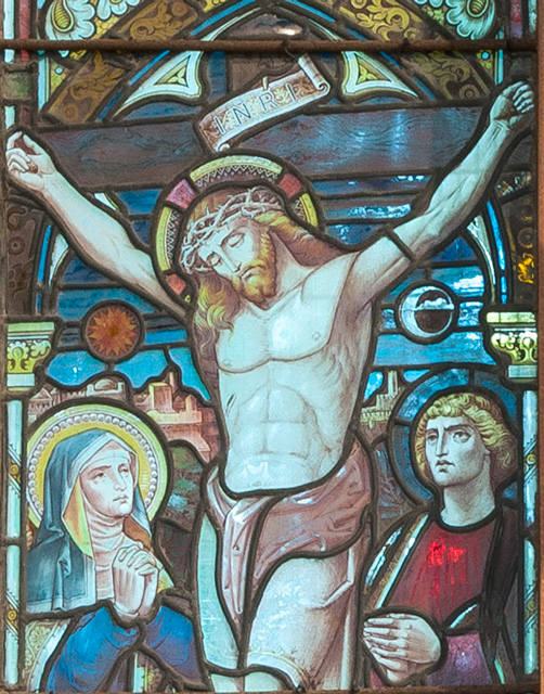 stained glass figure of Christ on the cross..