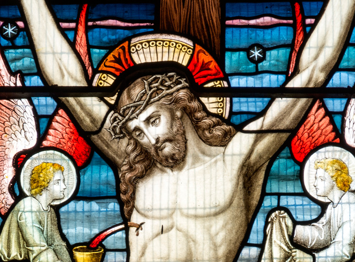 stained glass figure of Christ on the cross.