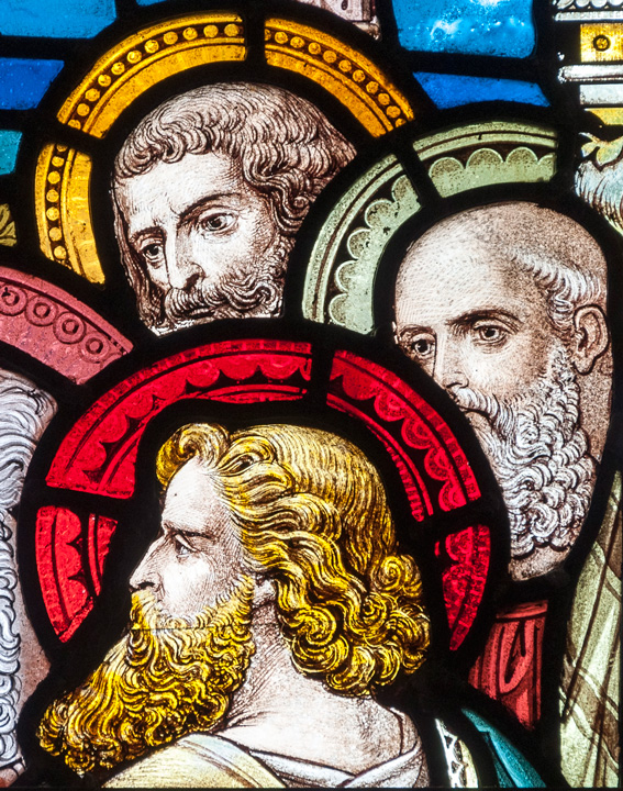 stained glass figure of the heads of apostles.